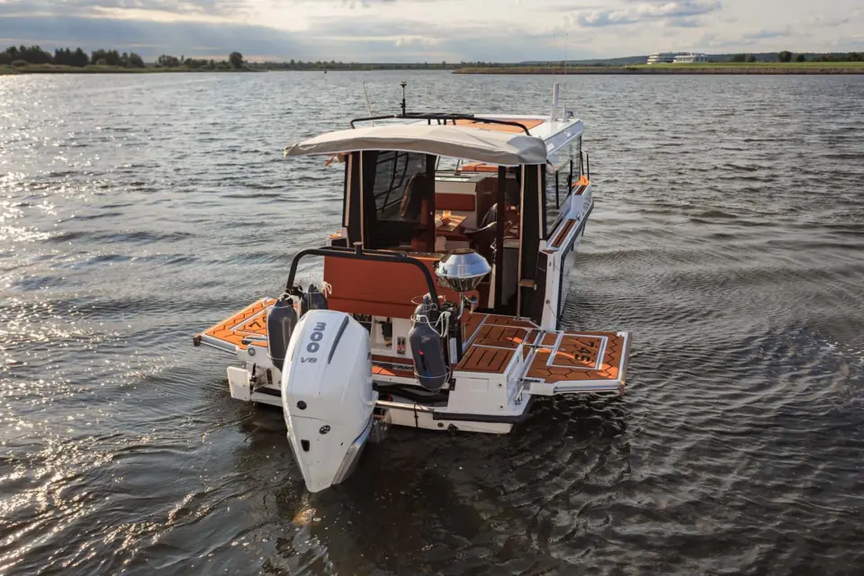 Front quarter view of the SEARENE 815 Crew Cabin yacht moored on calm water in the evening